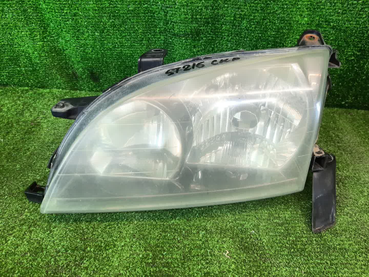 Фара левая передняя TOYOTA CALDINA ST215W, ST210G, ST215G, CT216, ST210, AT211, ST215, CT216G, AT211G 1 ракурс