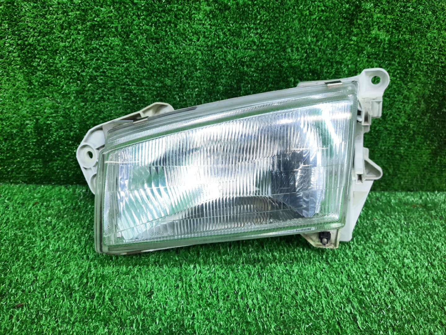 Фара левая передняя MAZDA DEMIO DW3W, DW5W 1 ракурс