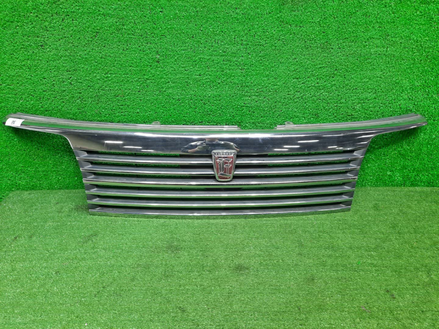 Решетка радиатора NISSAN ELGRAND ATE50, AVE50, ATWE50, ALWE50, APWE50, AVWE50, APE50, ALE50 62310-VE000 1 ракурс
