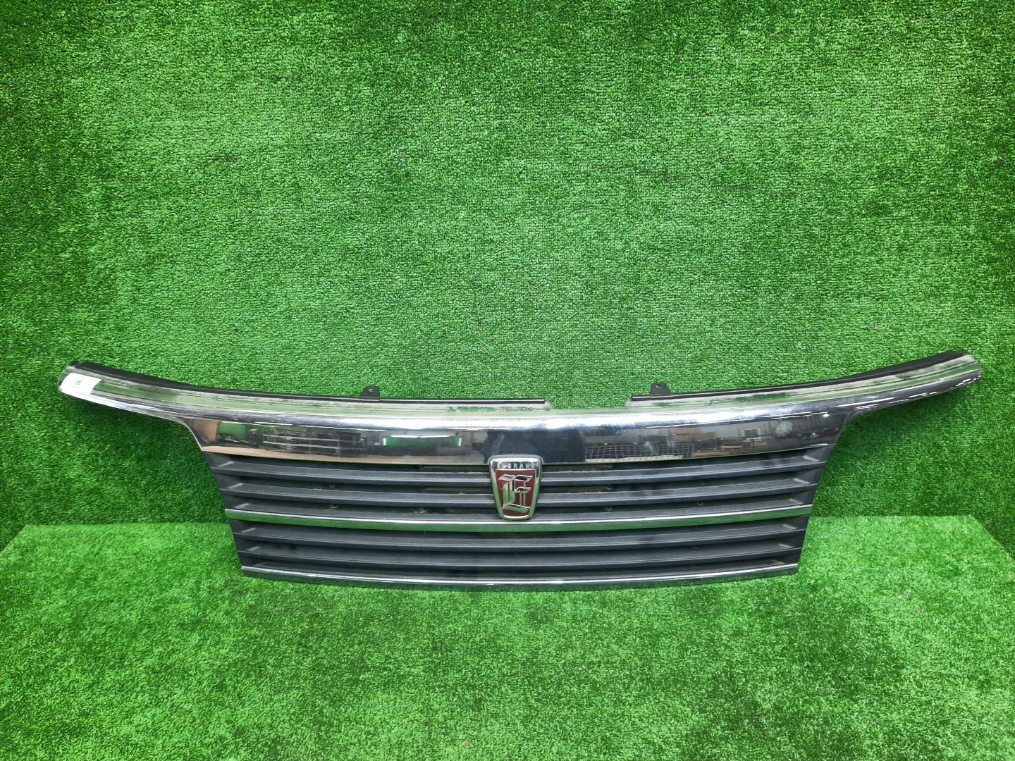 Решетка радиатора NISSAN ELGRAND ATE50, AVE50, ATWE50, ALWE50, APWE50, AVWE50, APE50, ALE50 62310-VE000 1 ракурс