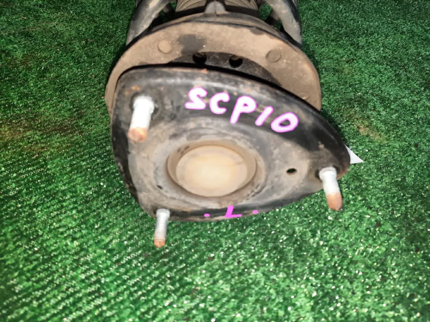 Стойка левая передняя TOYOTA FUNCARGO, IST, PLATZ, RAUM, VITZ, WILL VI, PROBOX, BB, PORTE, SUCCEED, WILL CYPHA NCP20, NCP21, NCP60, NCP61, NCP12, SCP11, NCZ20, SCP10, NCP10, SCP13, NCP13, NCP19, NCP51V, NCP58G, NCP50V, NLP51, NCP52V, NCP30, NCP31, NC